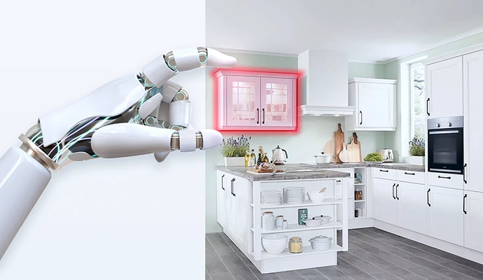 Eine Roboterhand berührt einen rotumrandeten Wandschrank in einer weißen Landhausküche, die offensichtlich gerade geplant wird. Eine Roboterhand berührt einen rotumrandeten Wandschrank in einer weißen Landhausküche, die offensichtlich gerade geplant wird.